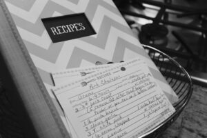 Stack of hand-lettered recipe cards tied with kitchen twine